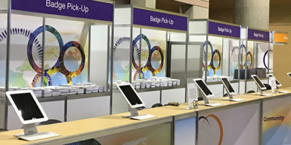 row of event check in kiosks from personify