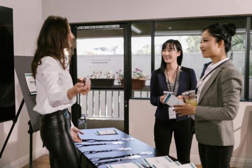 Ladies in the event check in process.